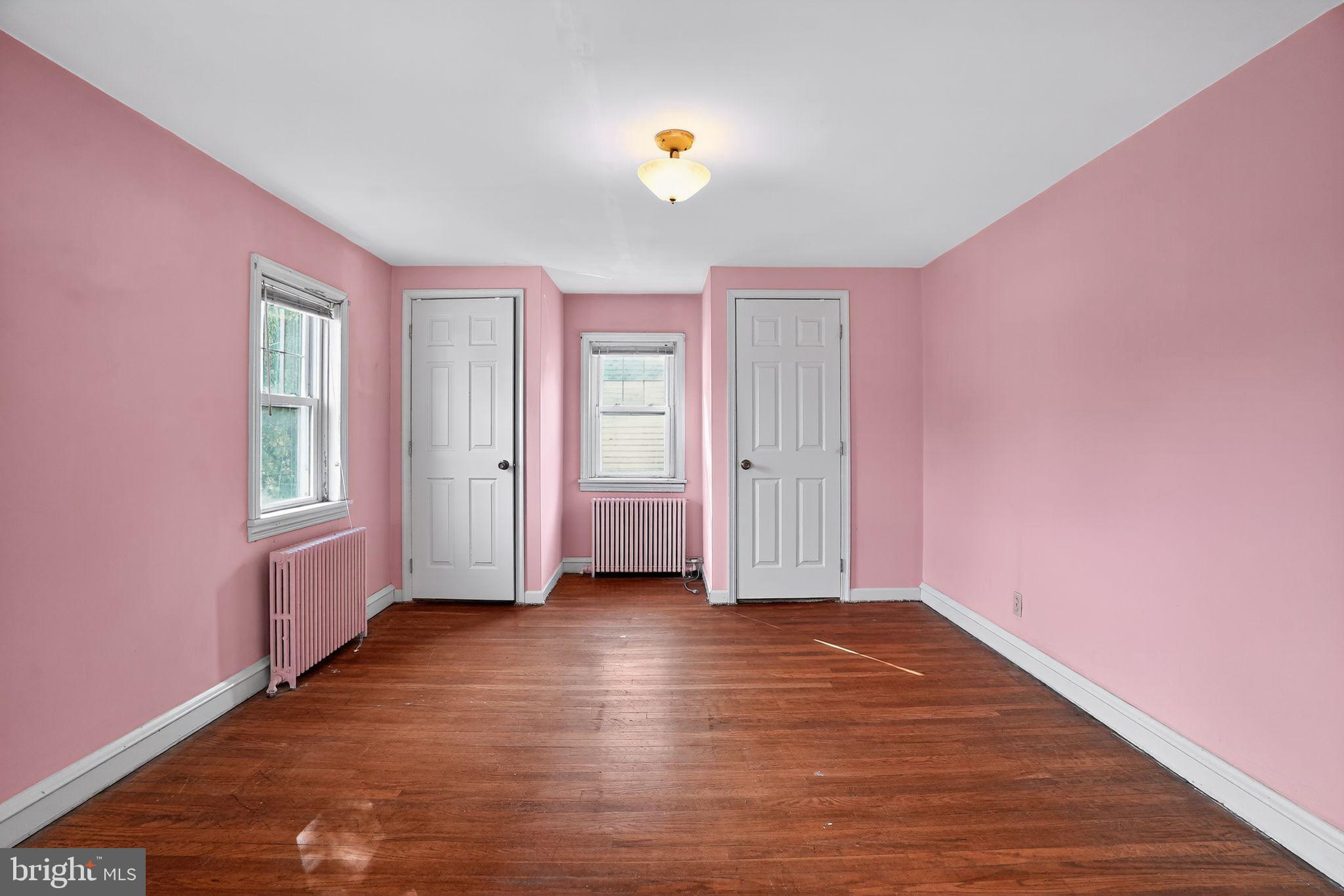 944 Galbraith Avenue Marcus Hook, PA 19061 - Photo 12 of 26 a view of an empty room with window and wooden floor