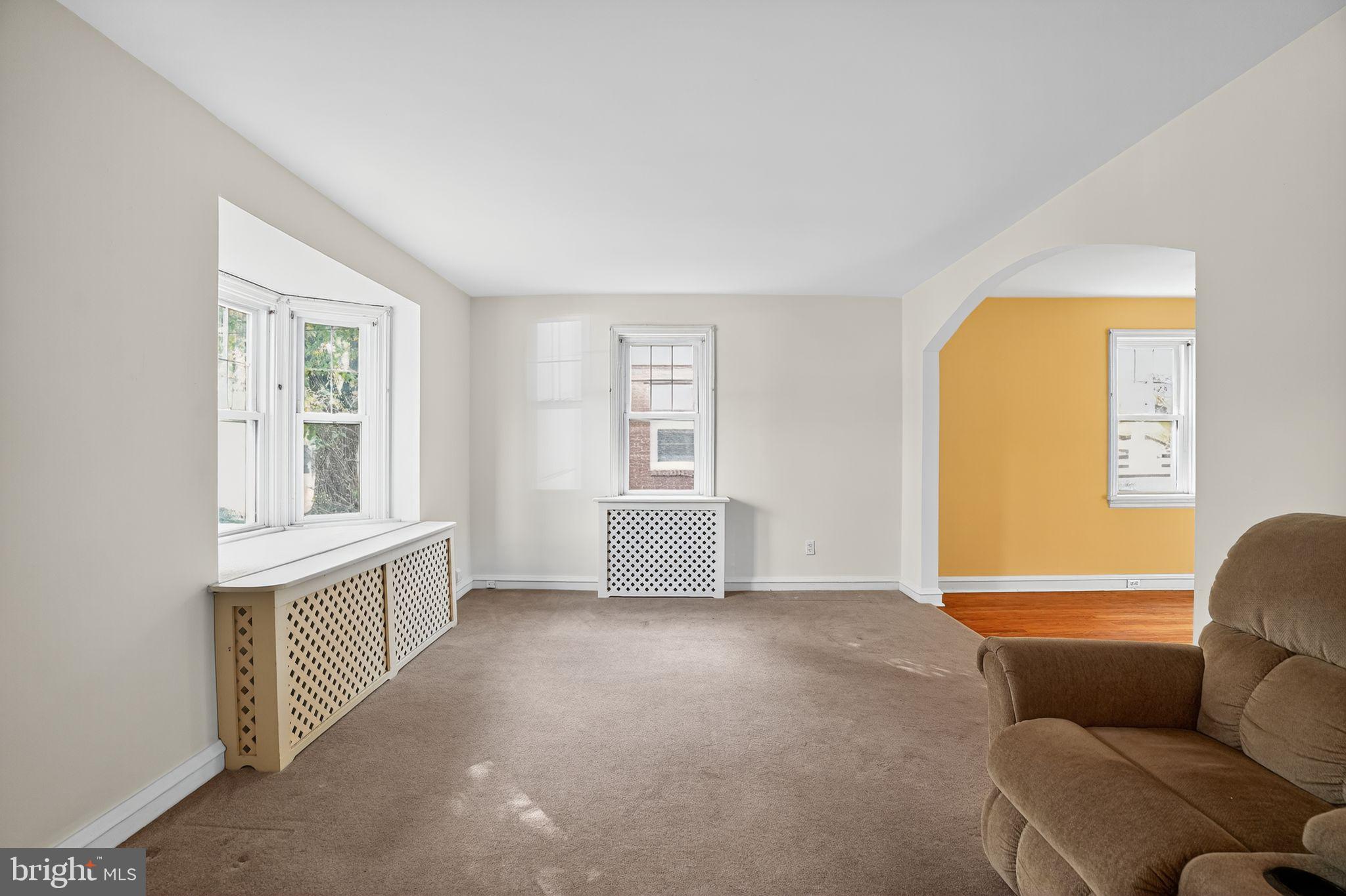 944 Galbraith Avenue Marcus Hook, PA 19061 - Photo 4 of 26 a living room with furniture and a window