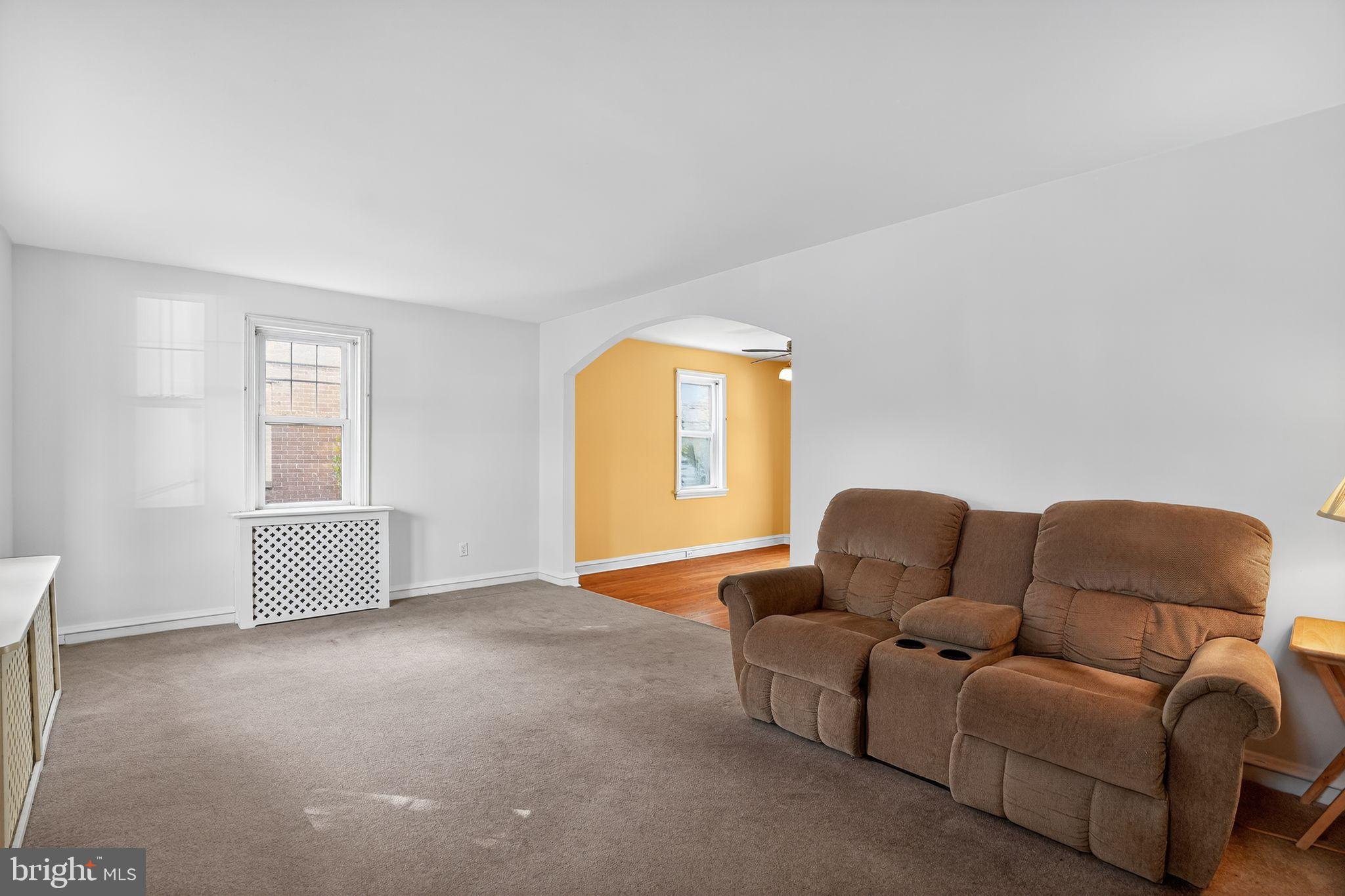 944 Galbraith Avenue Marcus Hook, PA 19061 - Photo 6 of 26 a living room with furniture and a window