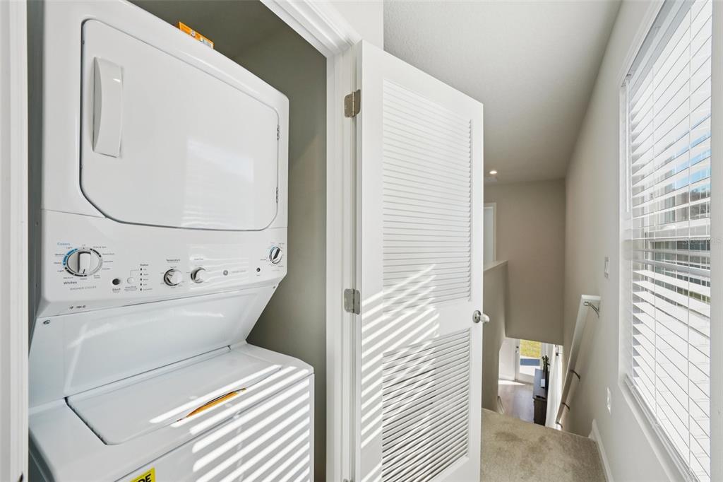 12057 Grizzly Lane New Port Richey, FL 34654 - Photo 11 of 25 a utility room with dryer and washer