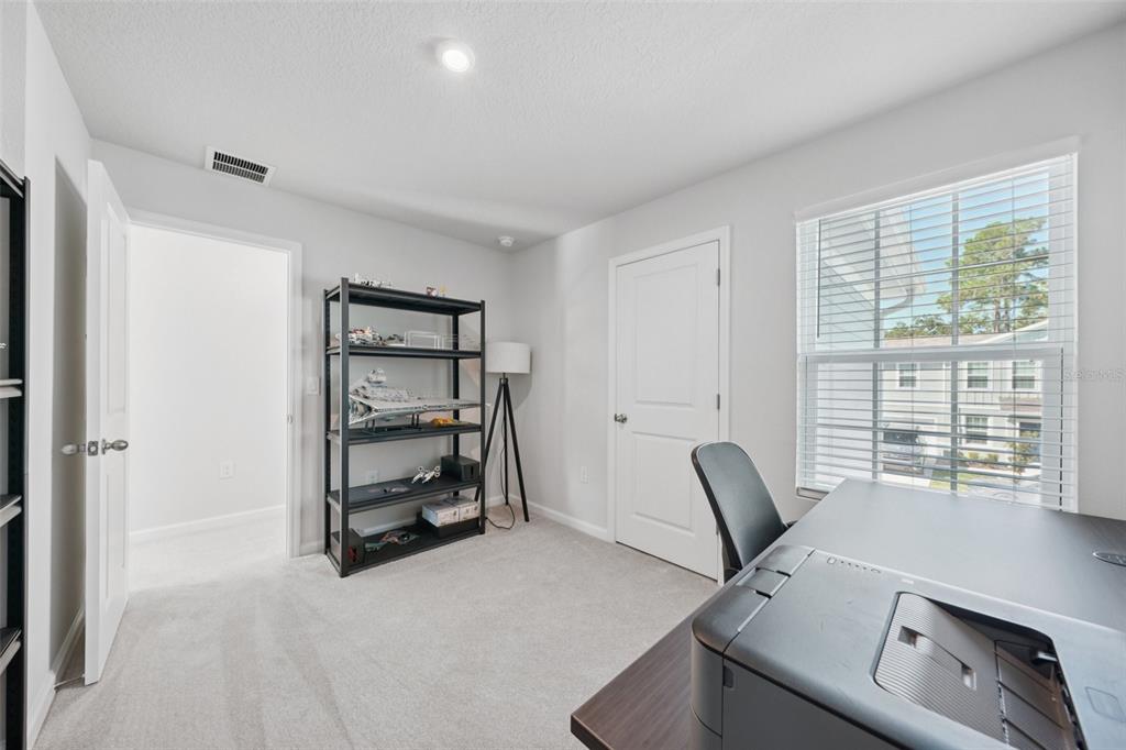 12057 Grizzly Lane New Port Richey, FL 34654 - Photo 17 of 25 a view of workspace with furniture and window