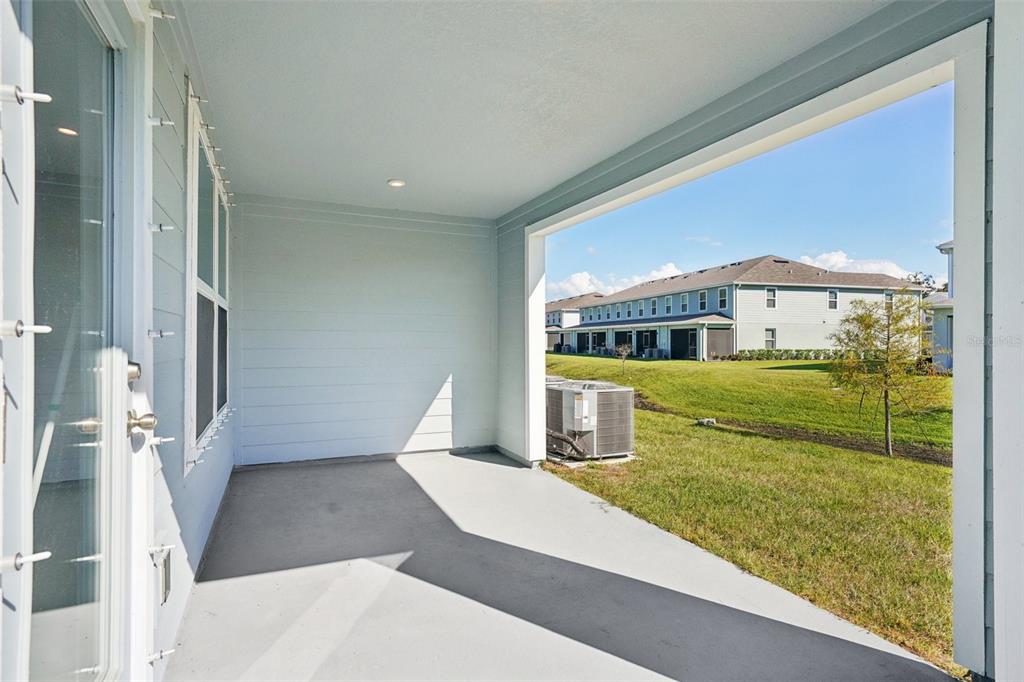 12057 Grizzly Lane New Port Richey, FL 34654 - Photo 22 of 25 a view of a house with a porch