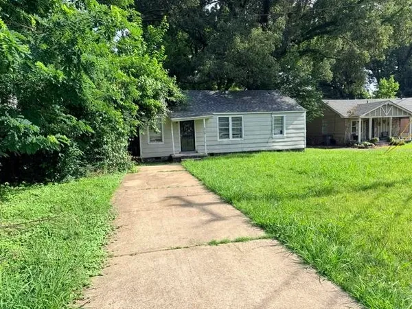 a front view of a house with yard