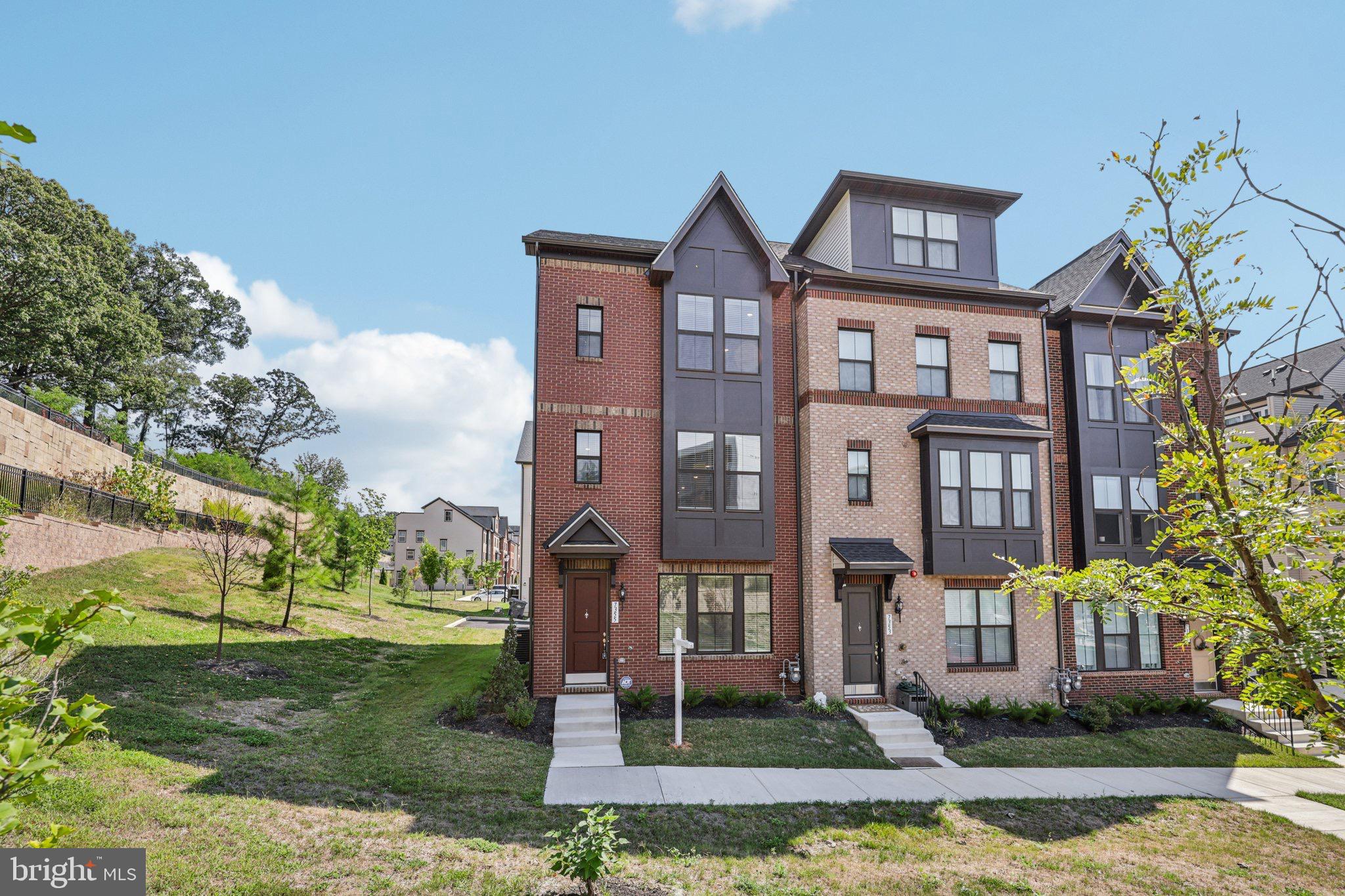 7355 Mountaineer Drive Alexandria, VA 22306 - Photo 1 of 47 a front view of a residential apartment building with a yard