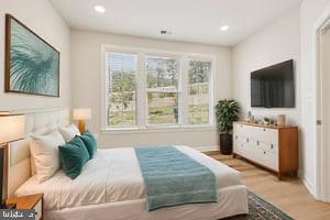 7355 Mountaineer Drive Alexandria, VA 22306 - Photo 11 of 47 a bedroom with a large bed and a flat screen tv