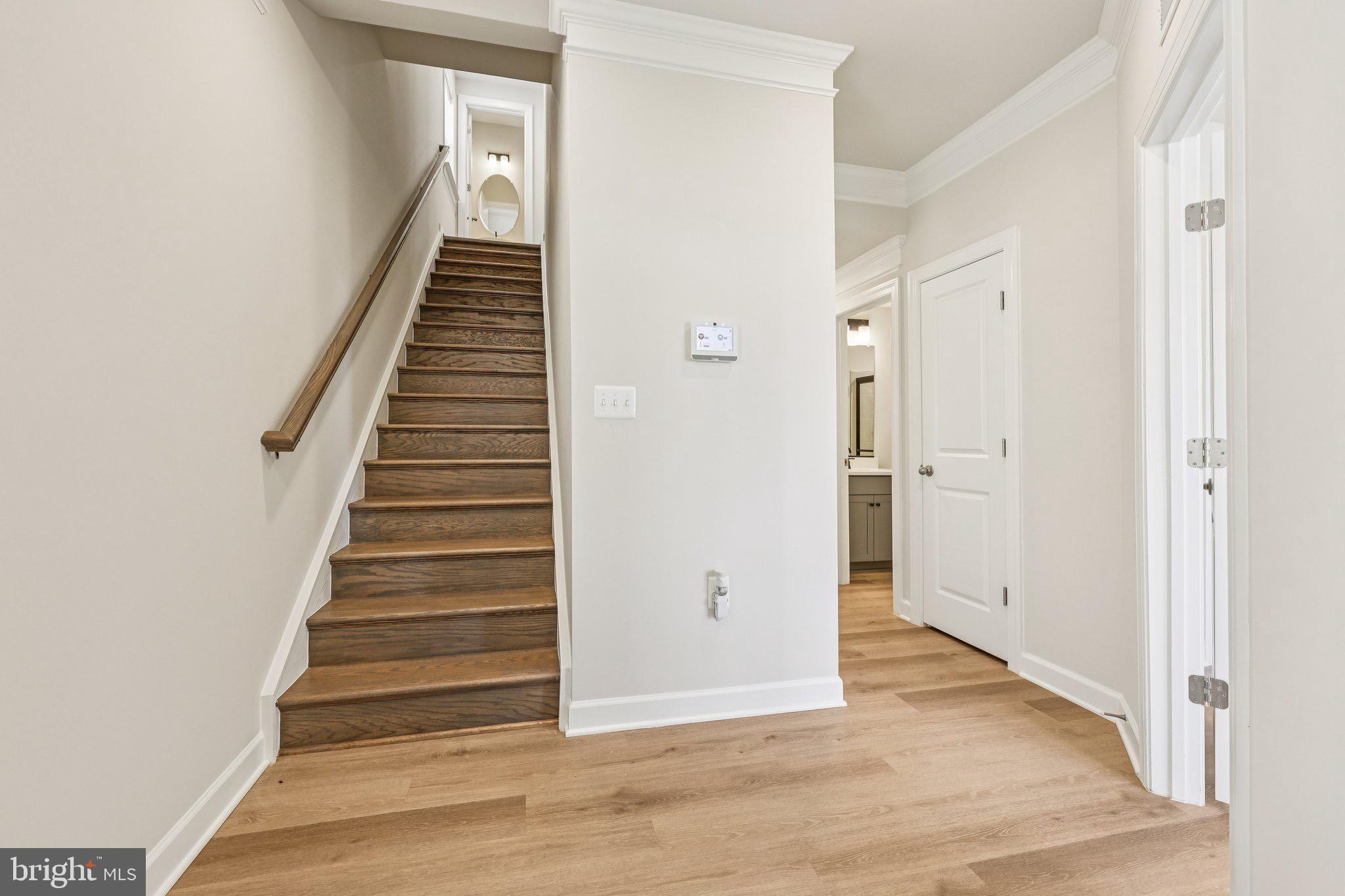 7355 Mountaineer Drive Alexandria, VA 22306 - Photo 13 of 47 a view of a hallway with wooden floor and entryway