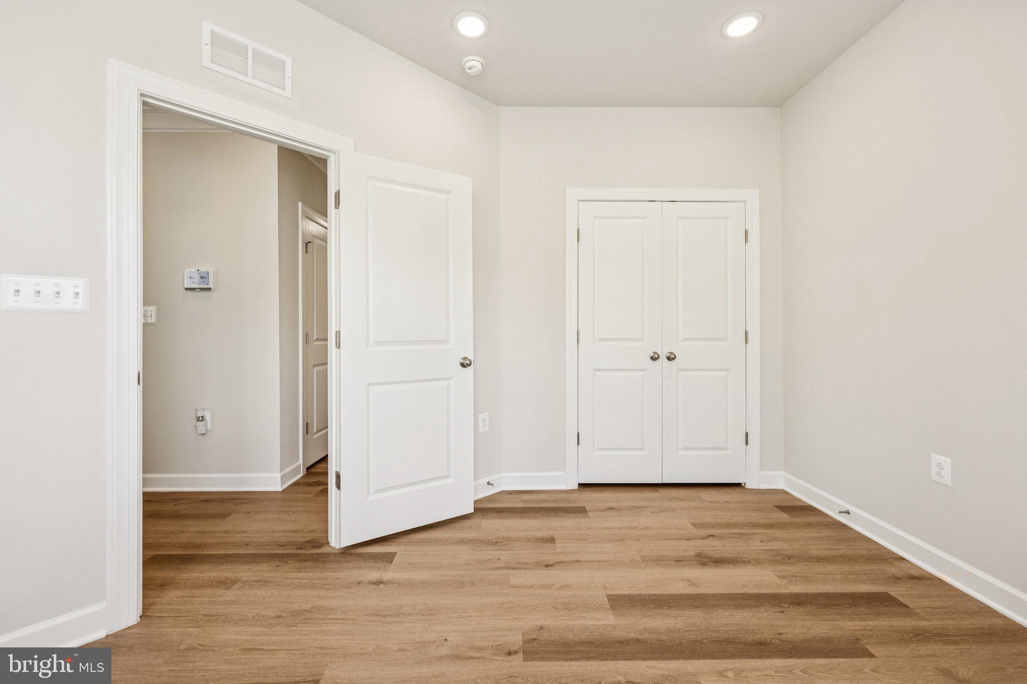 7355 Mountaineer Drive Alexandria, VA 22306 - Photo 14 of 47 an empty room with wooden floor and entrance