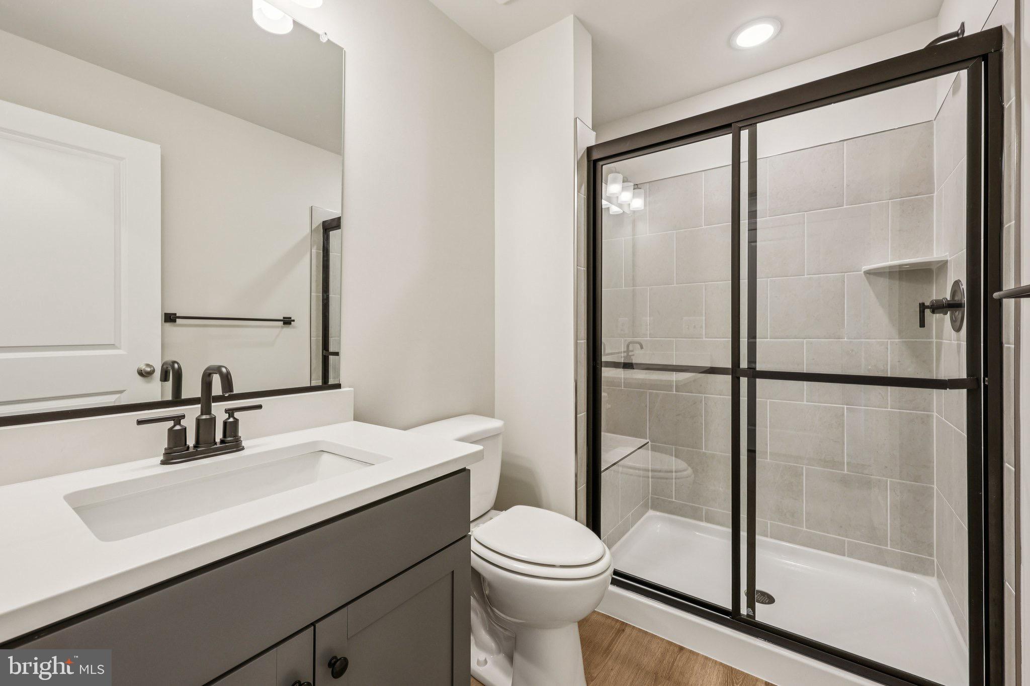 7355 Mountaineer Drive Alexandria, VA 22306 - Photo 16 of 47 a bathroom with a sink toilet and shower