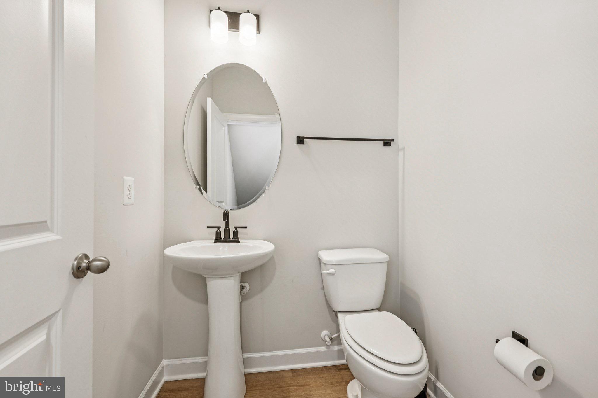 7355 Mountaineer Drive Alexandria, VA 22306 - Photo 17 of 47 a bathroom with a toilet sink and mirror
