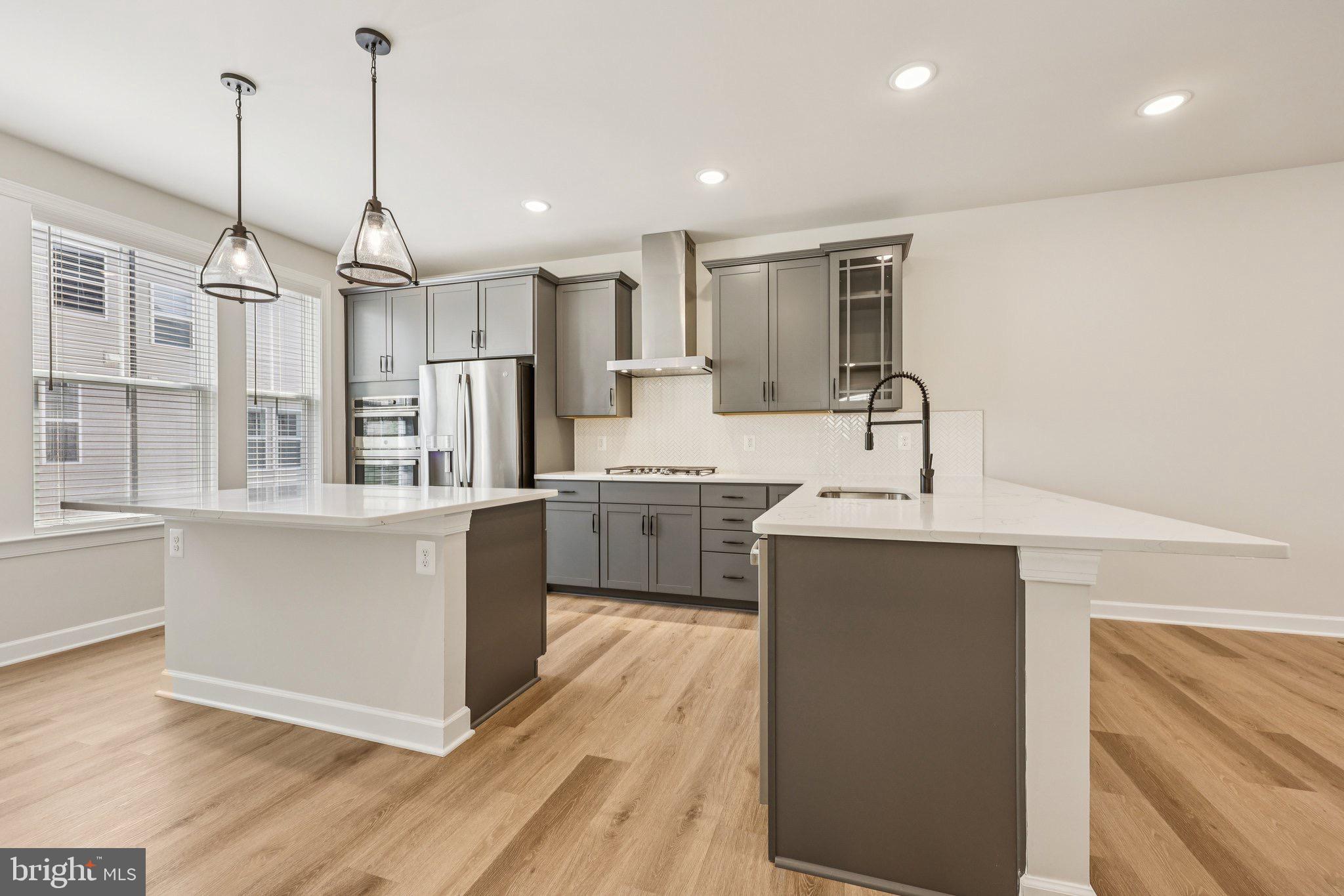 7355 Mountaineer Drive Alexandria, VA 22306 - Photo 18 of 47 a kitchen with a sink stainless steel appliances and counter space