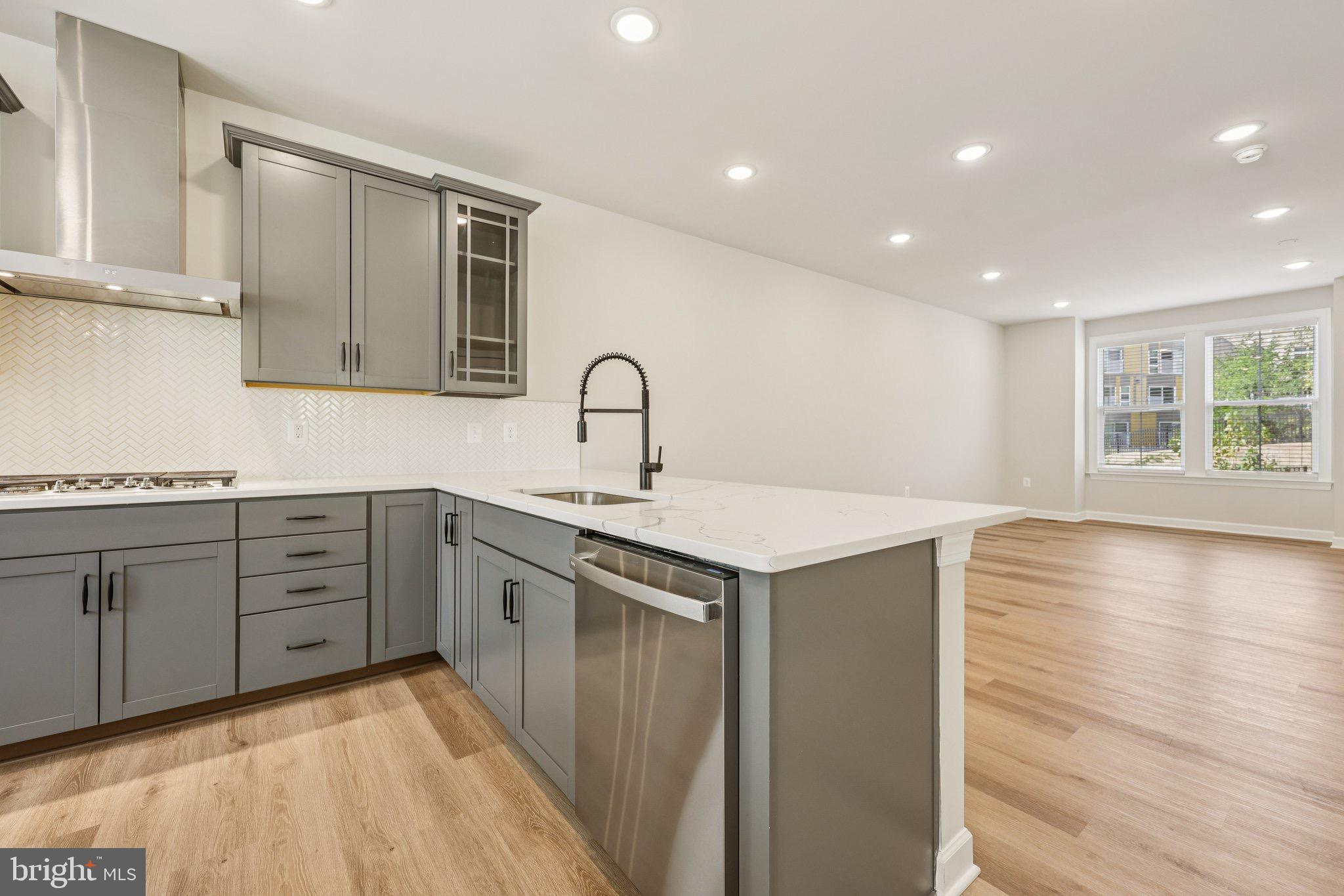 7355 Mountaineer Drive Alexandria, VA 22306 - Photo 19 of 47 a kitchen with a sink stove and cabinets