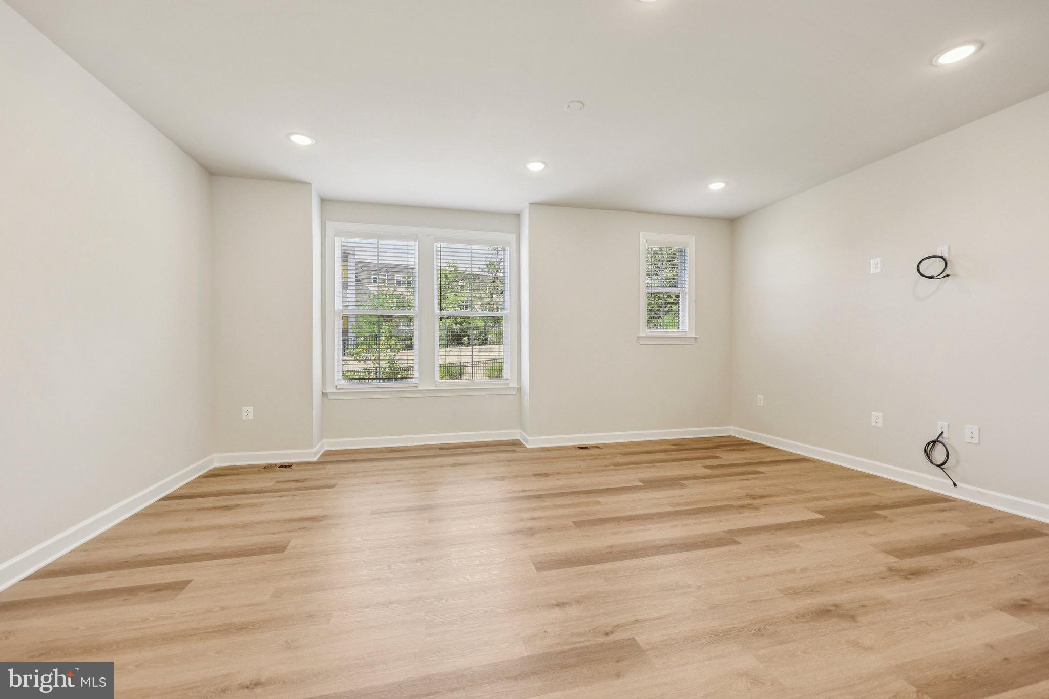 7355 Mountaineer Drive Alexandria, VA 22306 - Photo 28 of 47 a view of an empty room with wooden floor and a window