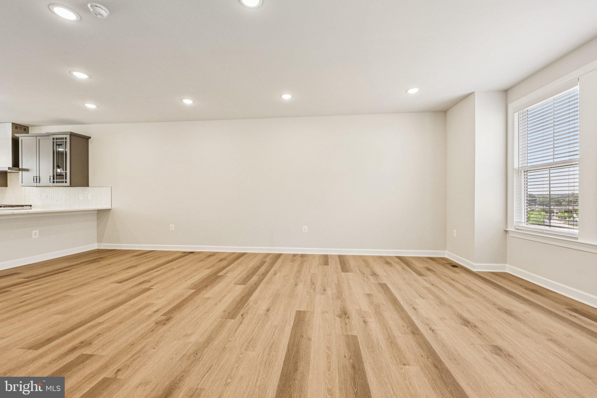 7355 Mountaineer Drive Alexandria, VA 22306 - Photo 29 of 47 a view of an empty room with wooden floor and a window
