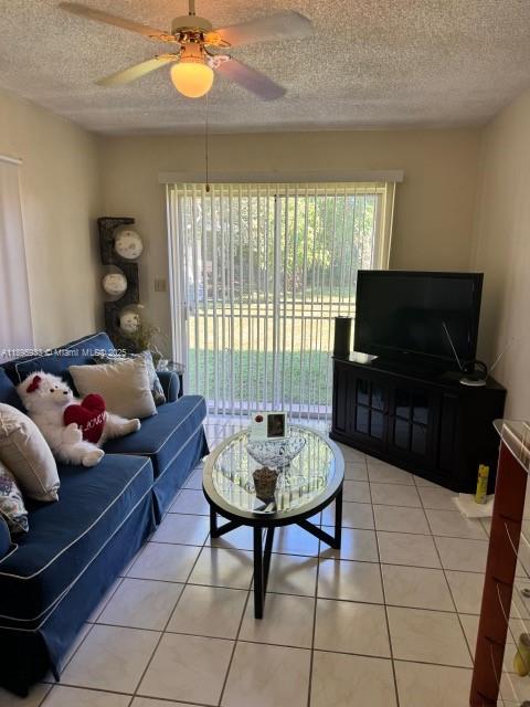 2343 Northwest 28th Street, Unit 12 Oakland Park, FL 33311 - Photo 25 of 34 a living room with furniture and a flat screen tv