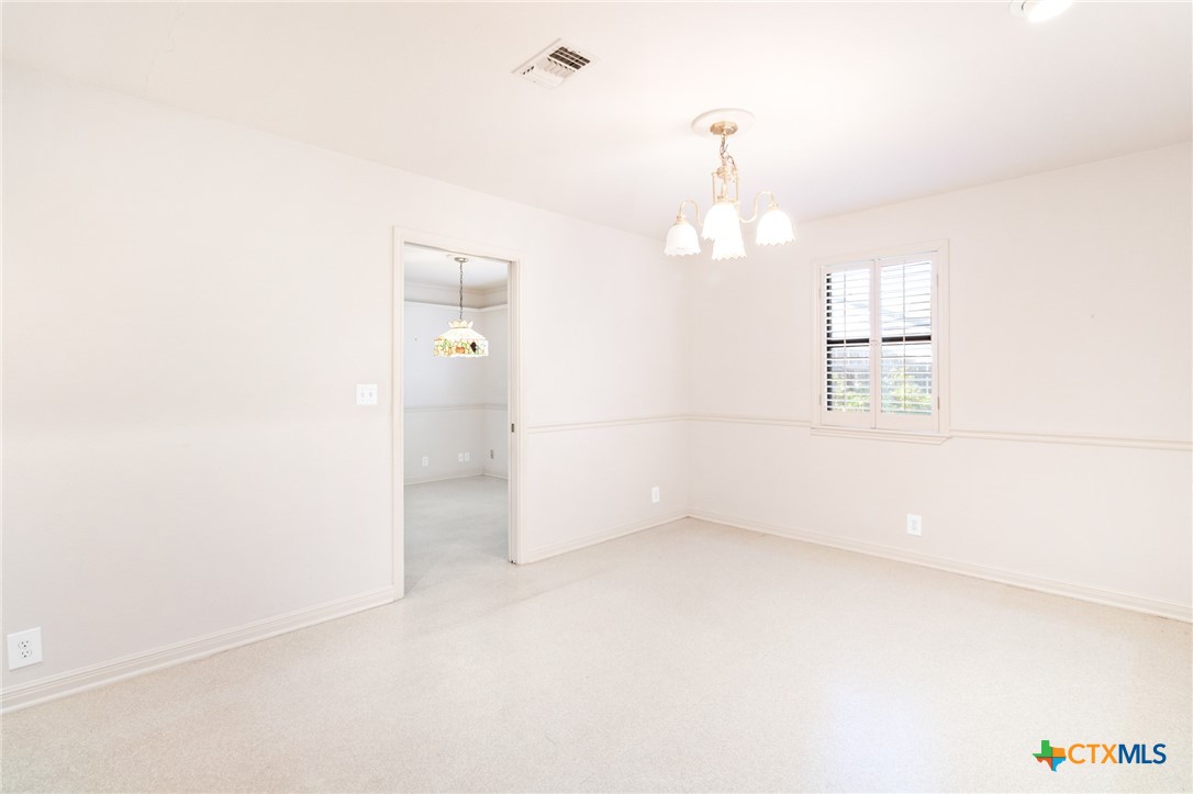 603 Suzanne Street Edna, TX 77957 - Photo 11 of 45 an empty room with a window