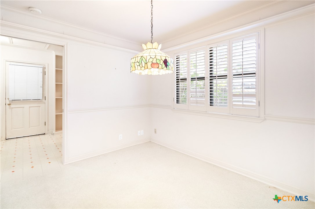 603 Suzanne Street Edna, TX 77957 - Photo 13 of 45 a view of an empty room with a window
