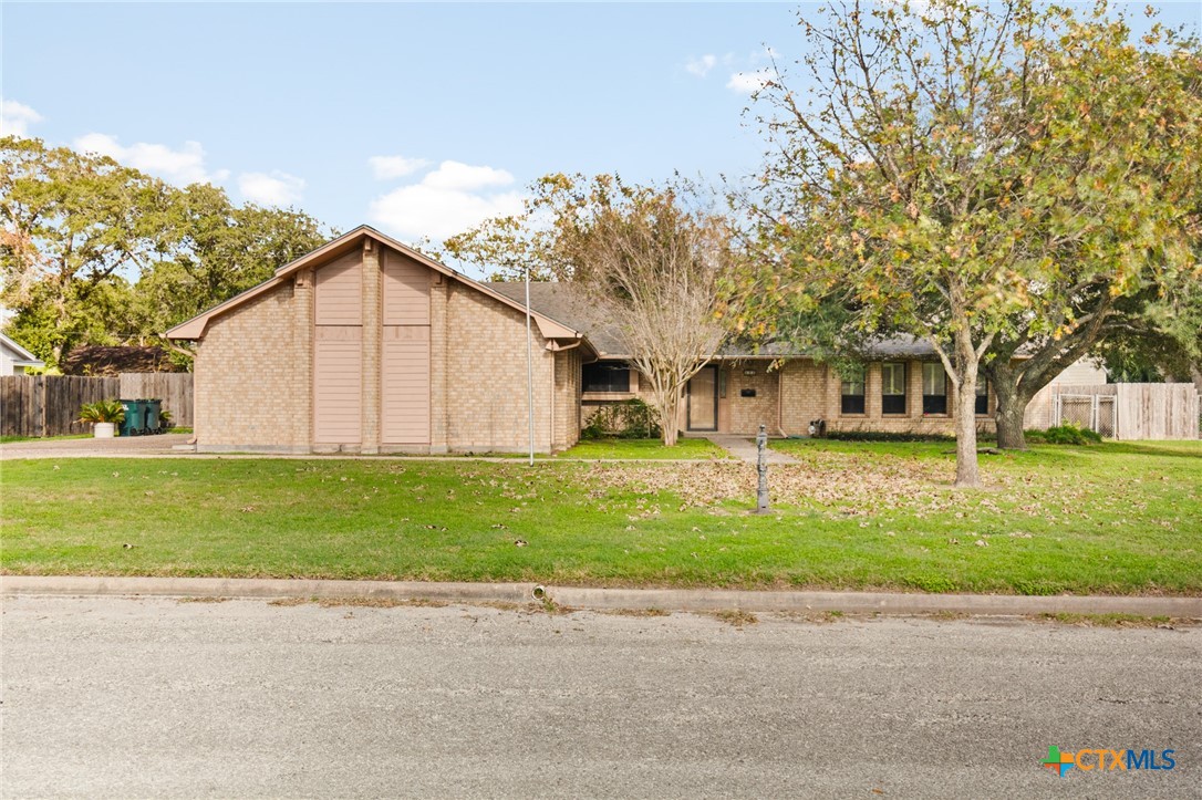 603 Suzanne Street Edna, TX 77957 - Photo 2 of 45 a view of a yard in front of a house