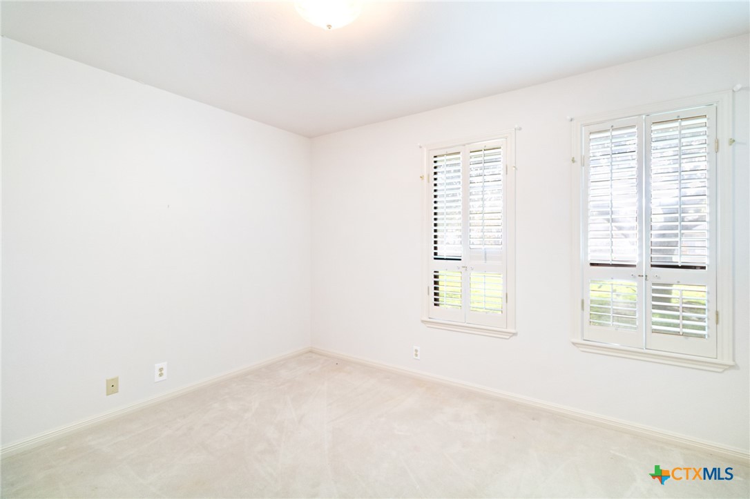 603 Suzanne Street Edna, TX 77957 - Photo 32 of 45 an empty room with a window