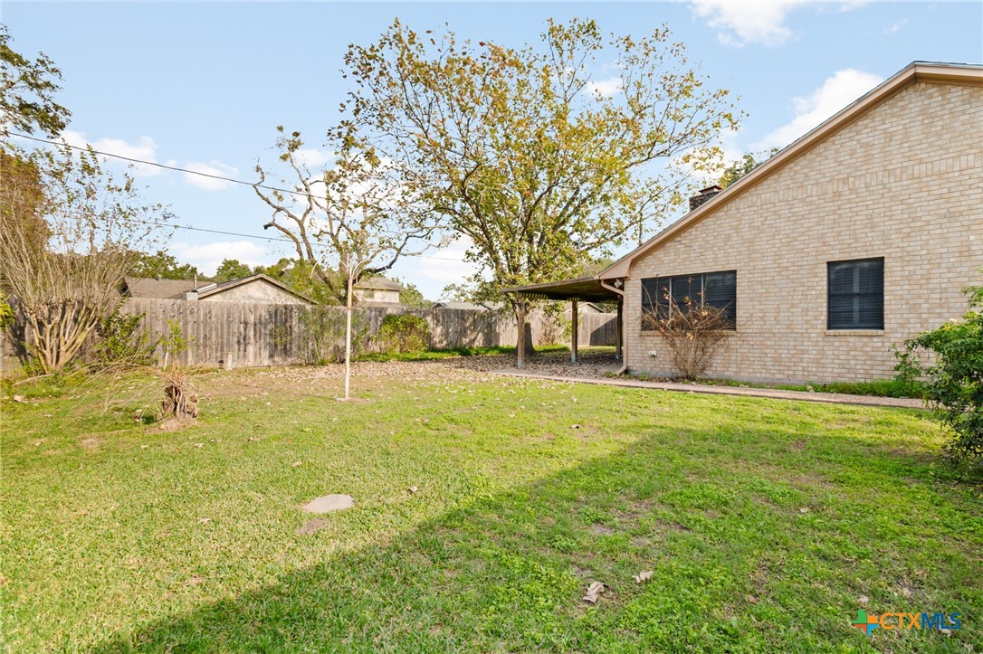 603 Suzanne Street Edna, TX 77957 - Photo 38 of 45 a backyard of a house with lots of green space