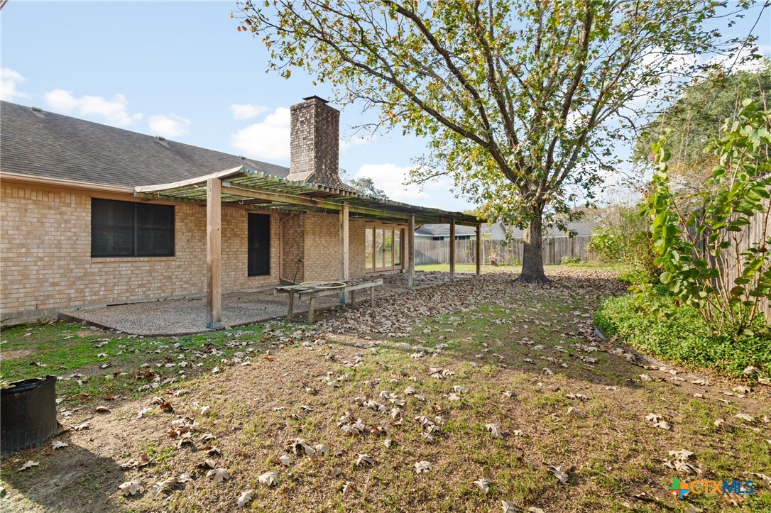 603 Suzanne Street Edna, TX 77957 - Photo 40 of 45 a front view of a house with garden