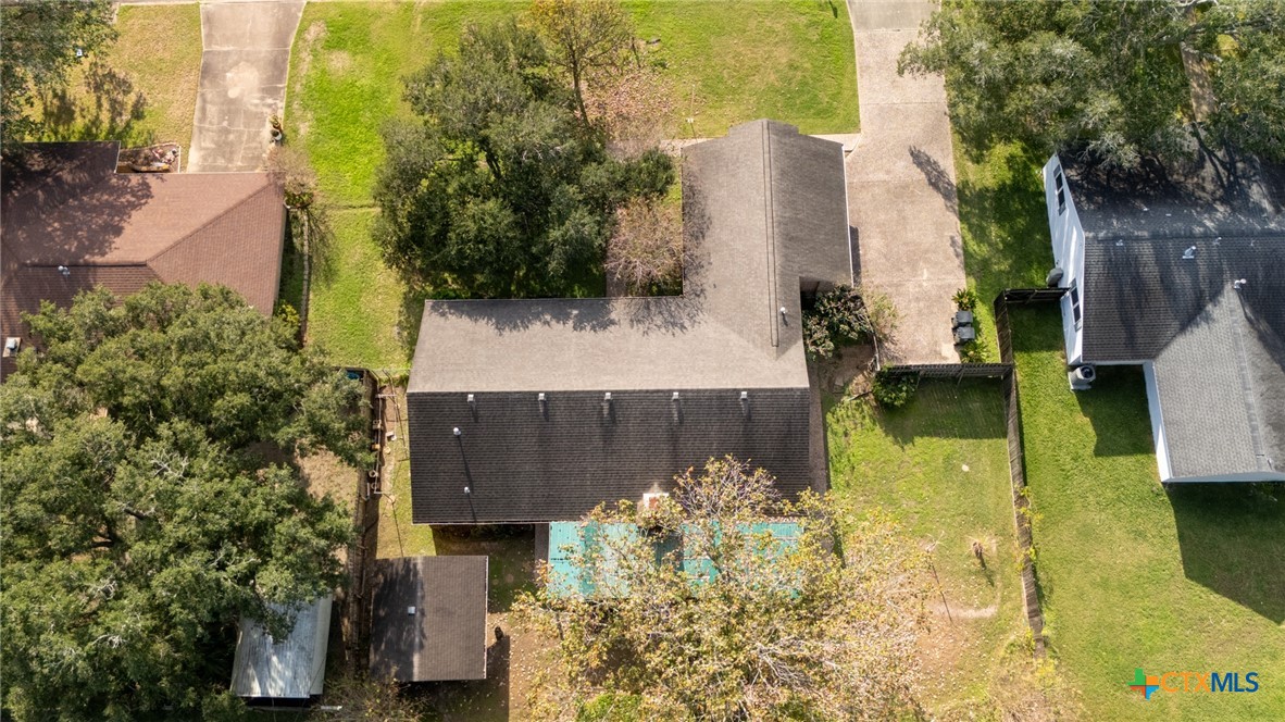 603 Suzanne Street Edna, TX 77957 - Photo 45 of 45 an aerial view of a house with swimming pool and large trees
