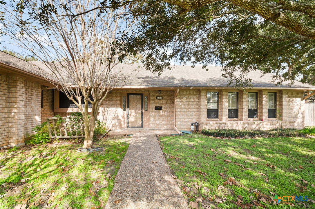 603 Suzanne Street Edna, TX 77957 - Photo 5 of 45 a front view of a house with a yard and porch