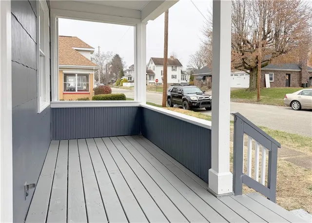 a room with window and view of balcony