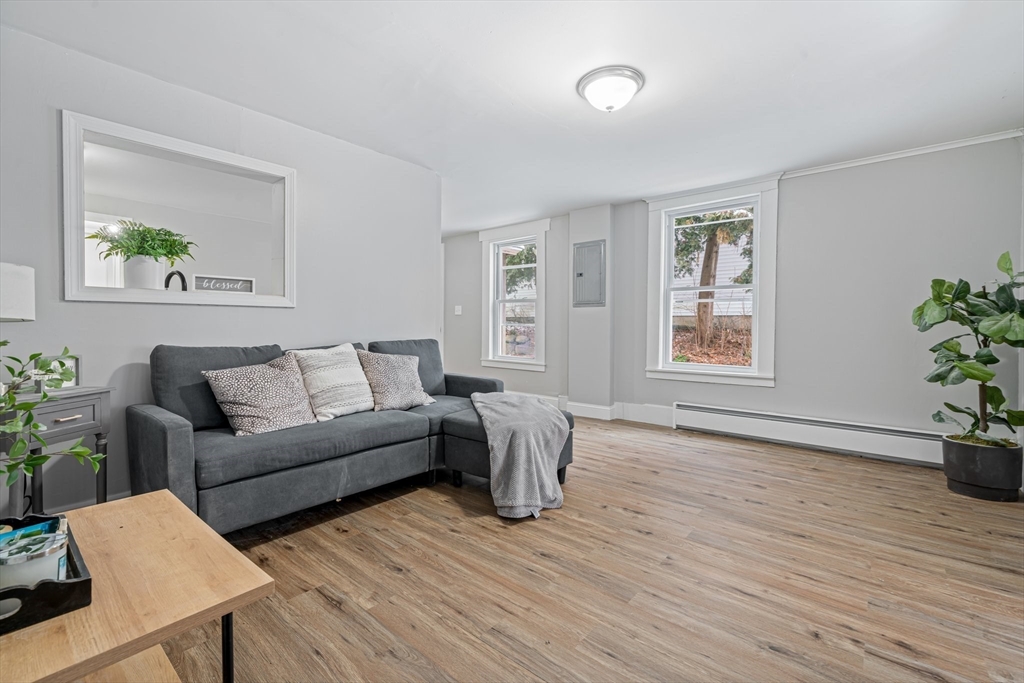 124 Cottage Street Athol, MA 01331 - Photo 15 of 38 a living room with furniture and a wooden floor