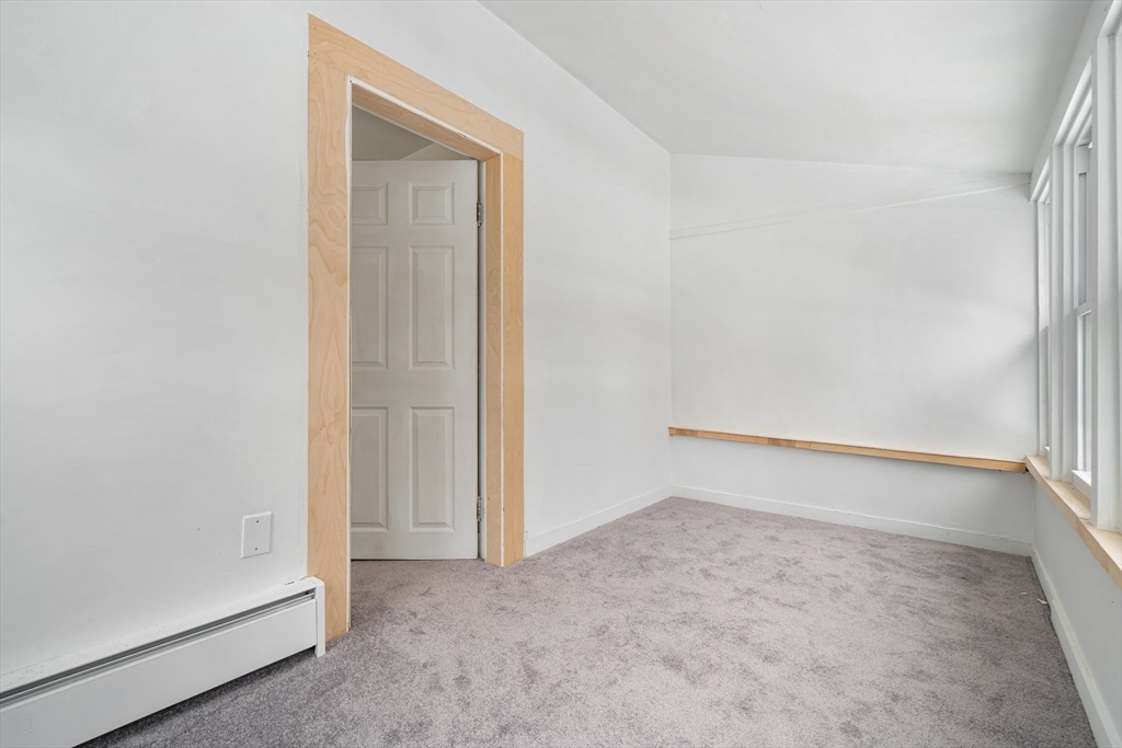 124 Cottage Street Athol, MA 01331 - Photo 25 of 38 an empty room with a door