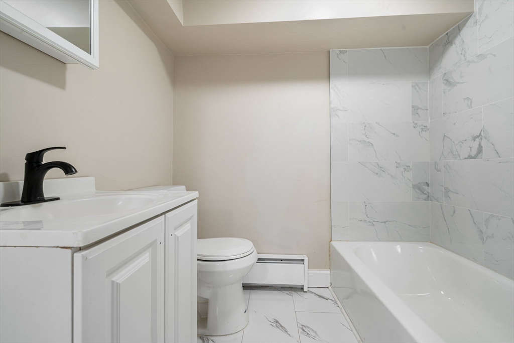 124 Cottage Street Athol, MA 01331 - Photo 28 of 38 a bathroom with a sink a toilet and bathtub