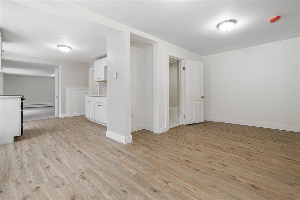 124 Cottage Street Athol, MA 01331 - Photo 29 of 38 a view of empty room with wooden floor