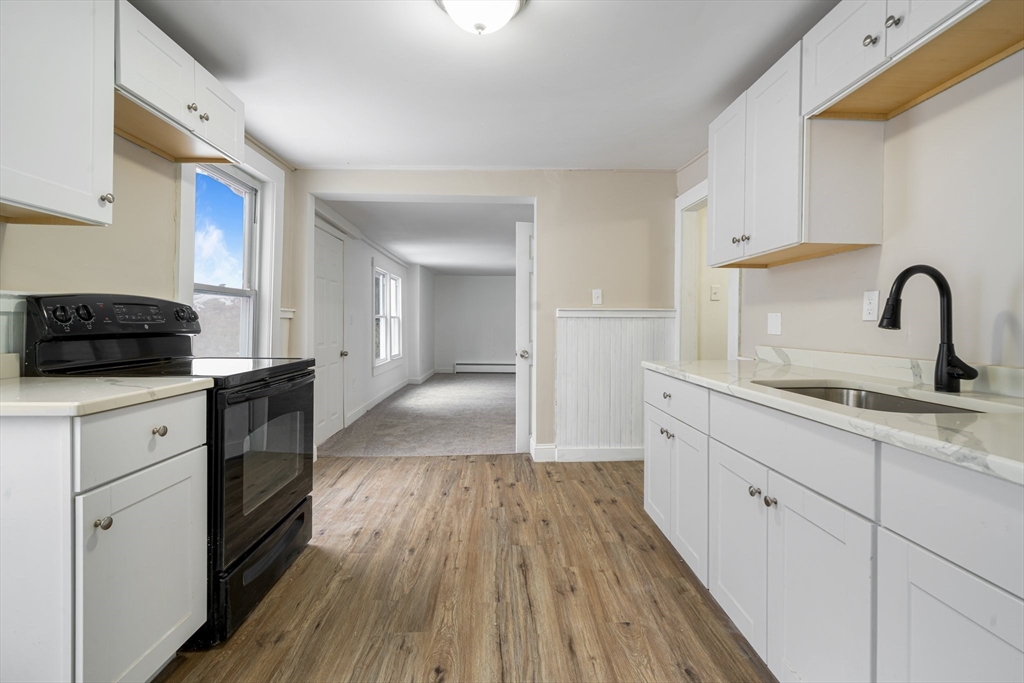 124 Cottage Street Athol, MA 01331 - Photo 30 of 38 a kitchen with a sink and wooden floor