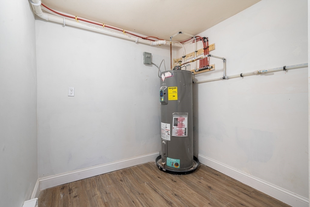 124 Cottage Street Athol, MA 01331 - Photo 32 of 38 a view of storage and utility room with wooden floor