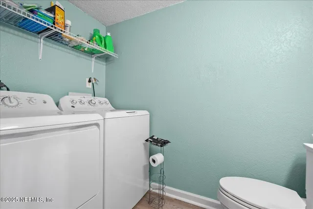 a bathroom with a toilet and a vanity