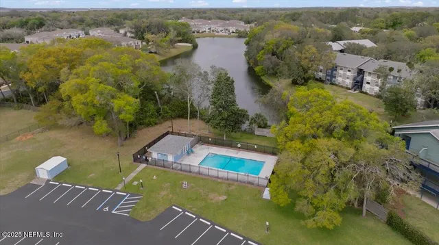 an aerial view of a house with a lake view
