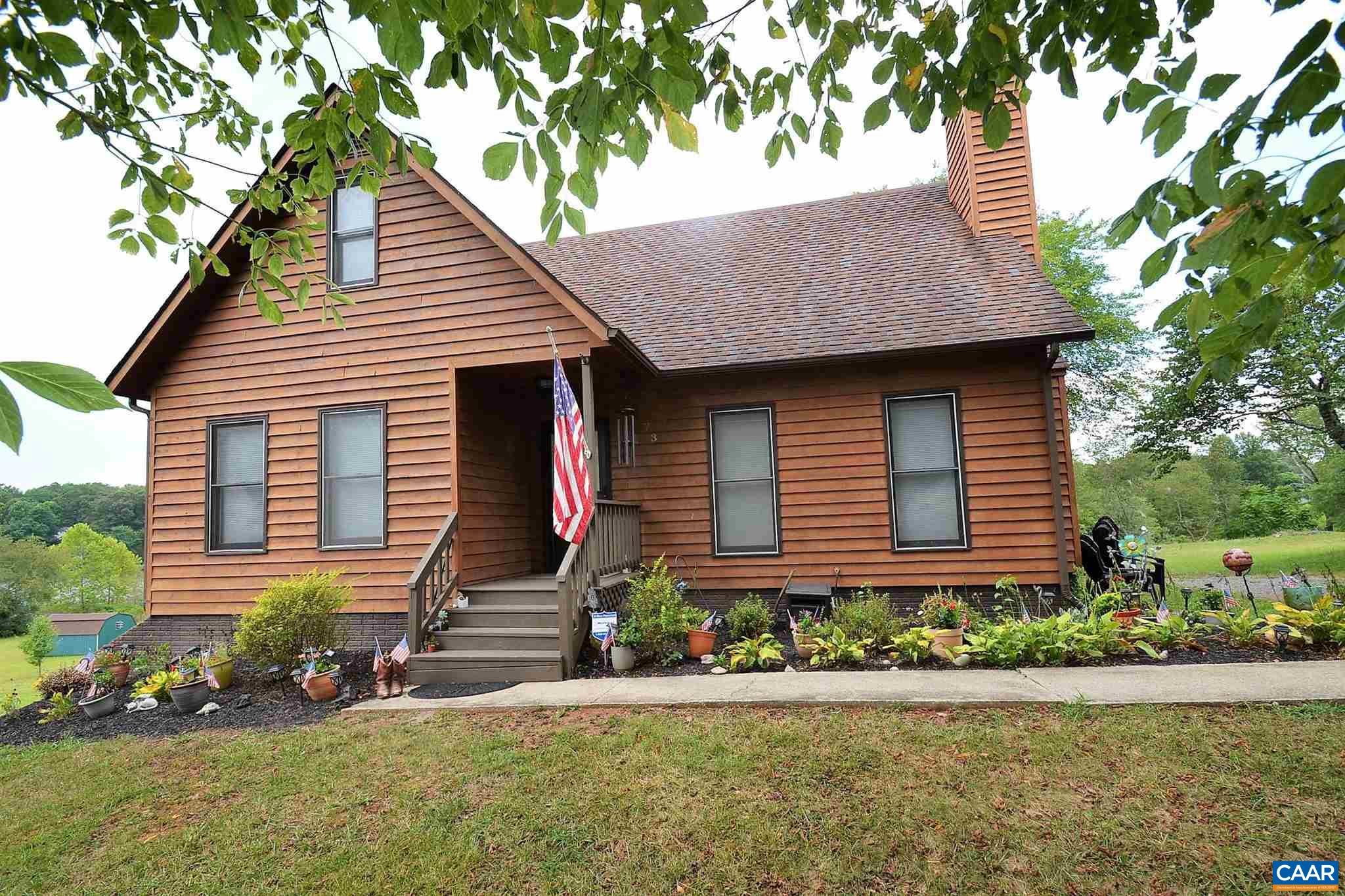 73 East Daffodil Road Ruckersville, VA 22968 - Photo 54 of 54 a front view of a house with a yard and potted plants