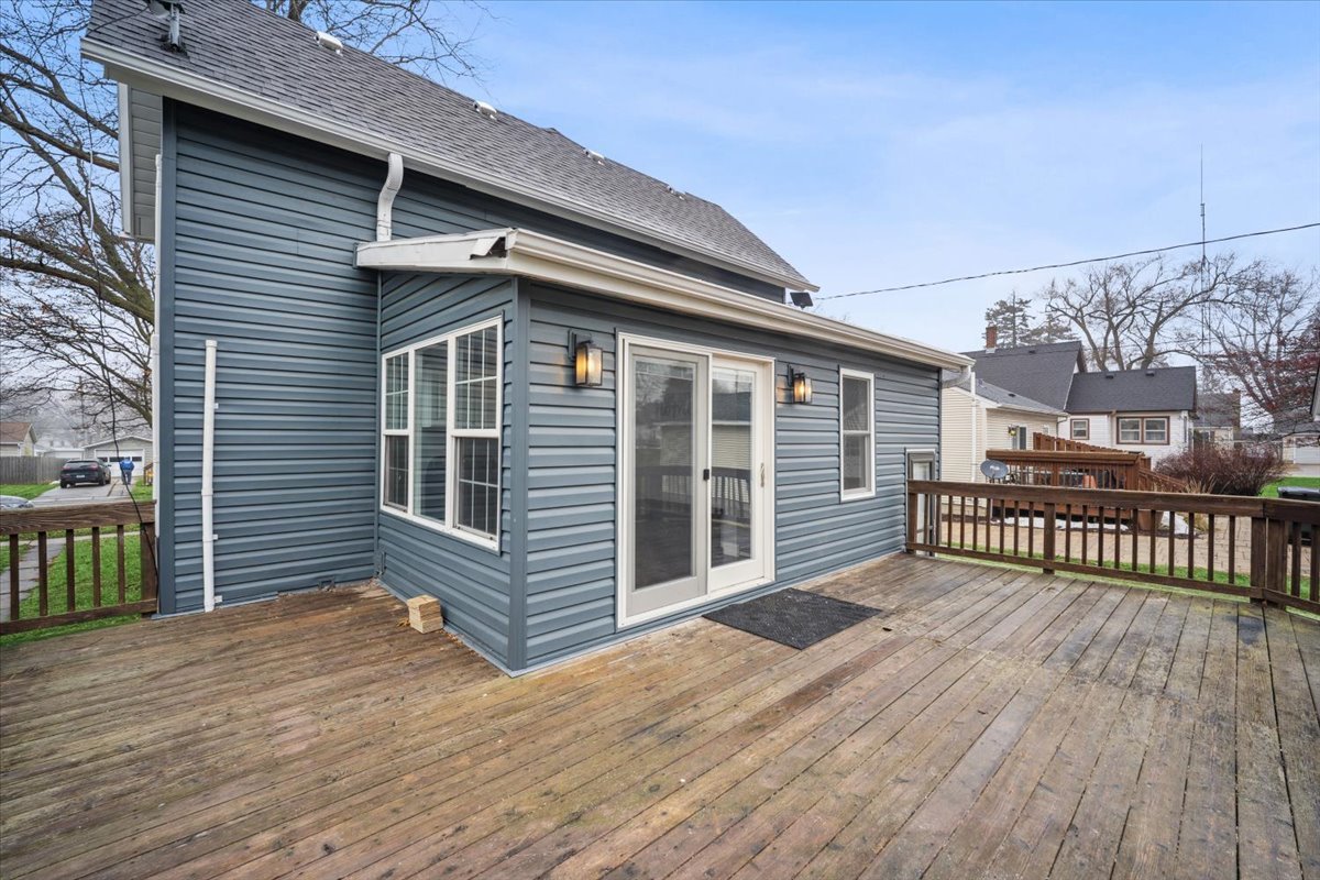 128 North Hadsall Street Genoa, IL 60135 - Photo 14 of 22 a view of a house with wooden deck