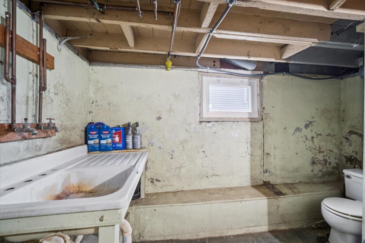128 North Hadsall Street Genoa, IL 60135 - Photo 18 of 22 a bathroom with a granite countertop bathtub and sink