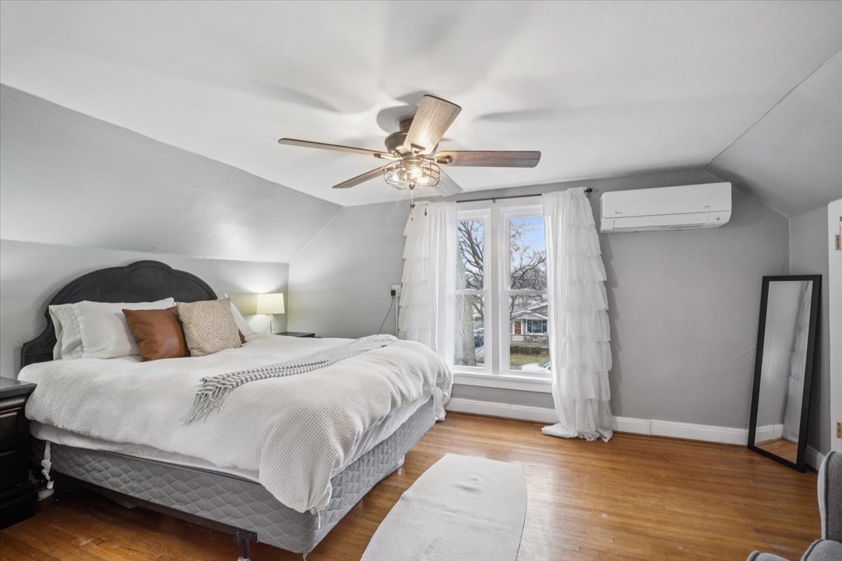 128 North Hadsall Street Genoa, IL 60135 - Photo 9 of 21 a bedroom with a bed and a ceiling fan
