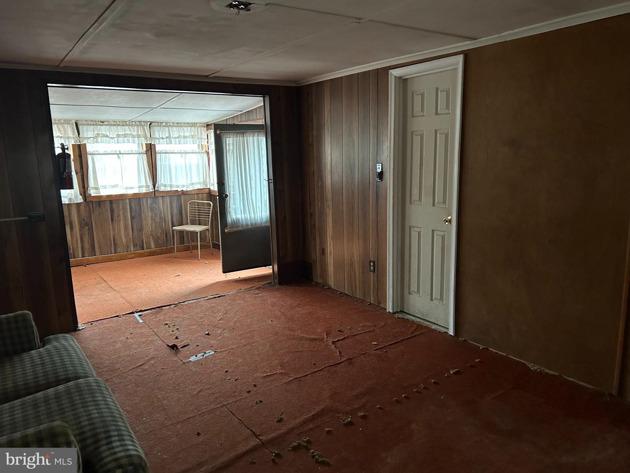 30 Pine Tree Trail Orrtanna, PA 17353 - Photo 8 of 12 an empty room with wooden floor and windows