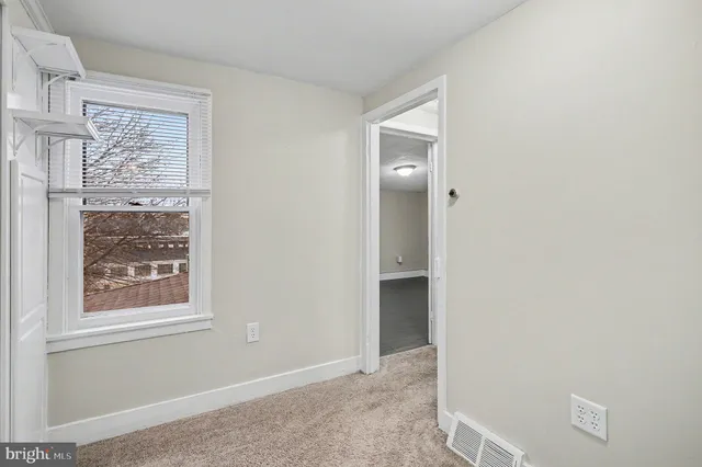 a room with a sink and a window