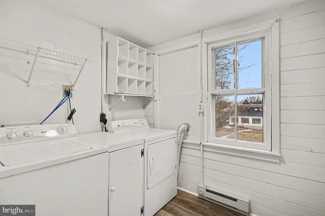 a view of a room with wooden walls