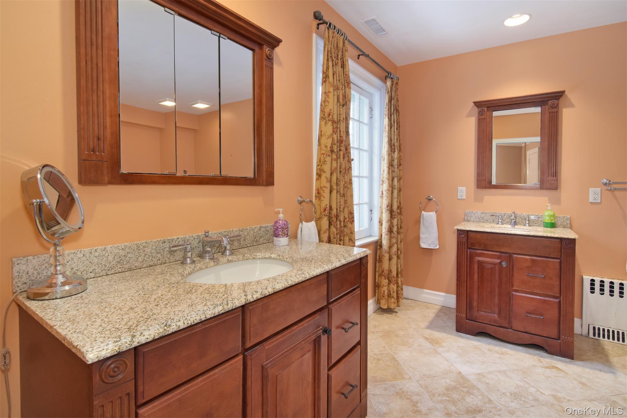 4610 Boston Post Road Pelham, NY 10803 - Photo 22 of 32 a bathroom with a granite countertop sink and a mirror