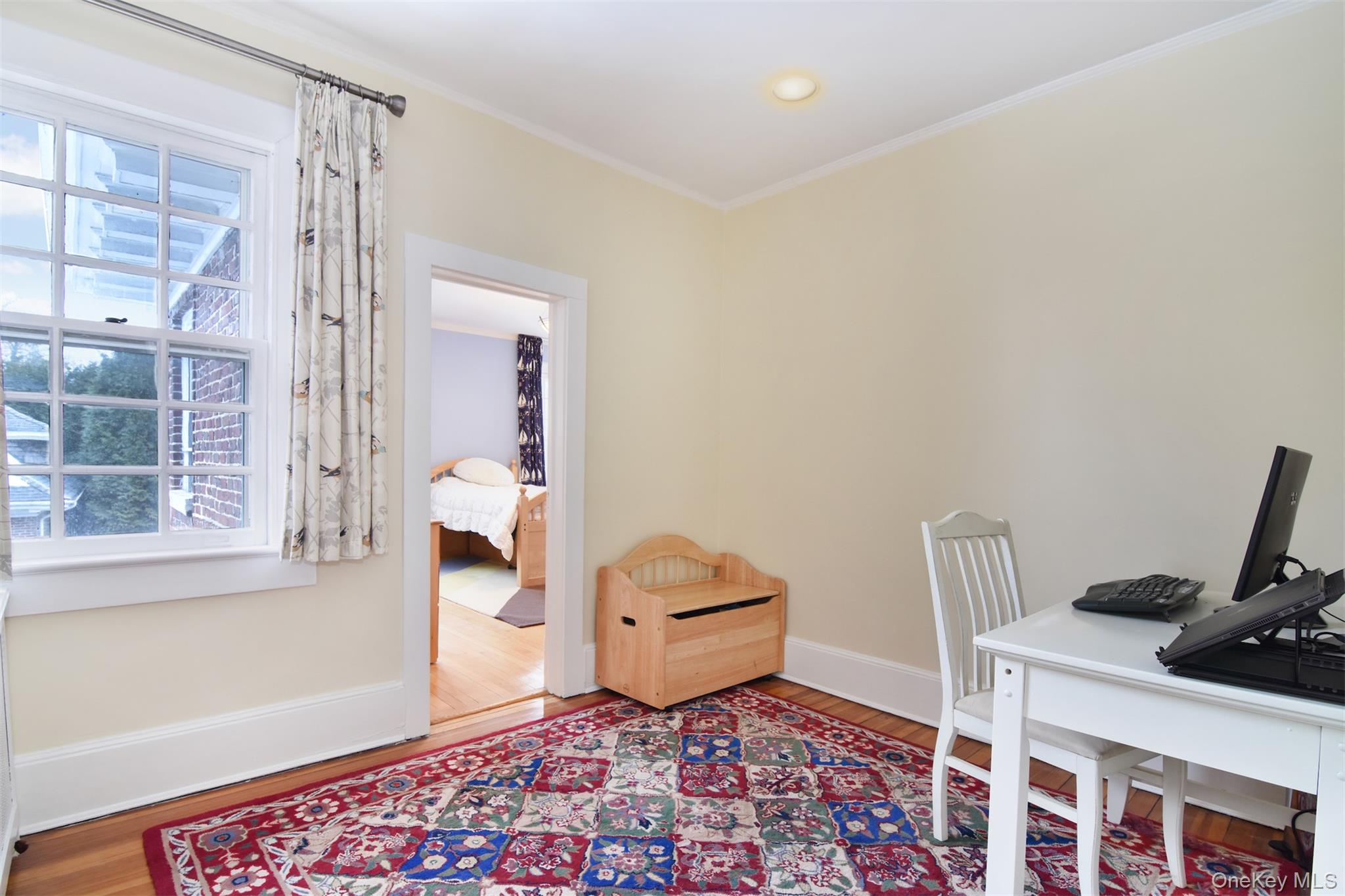 4610 Boston Post Road Pelham, NY 10803 - Photo 27 of 32 a bedroom with a bed and a window