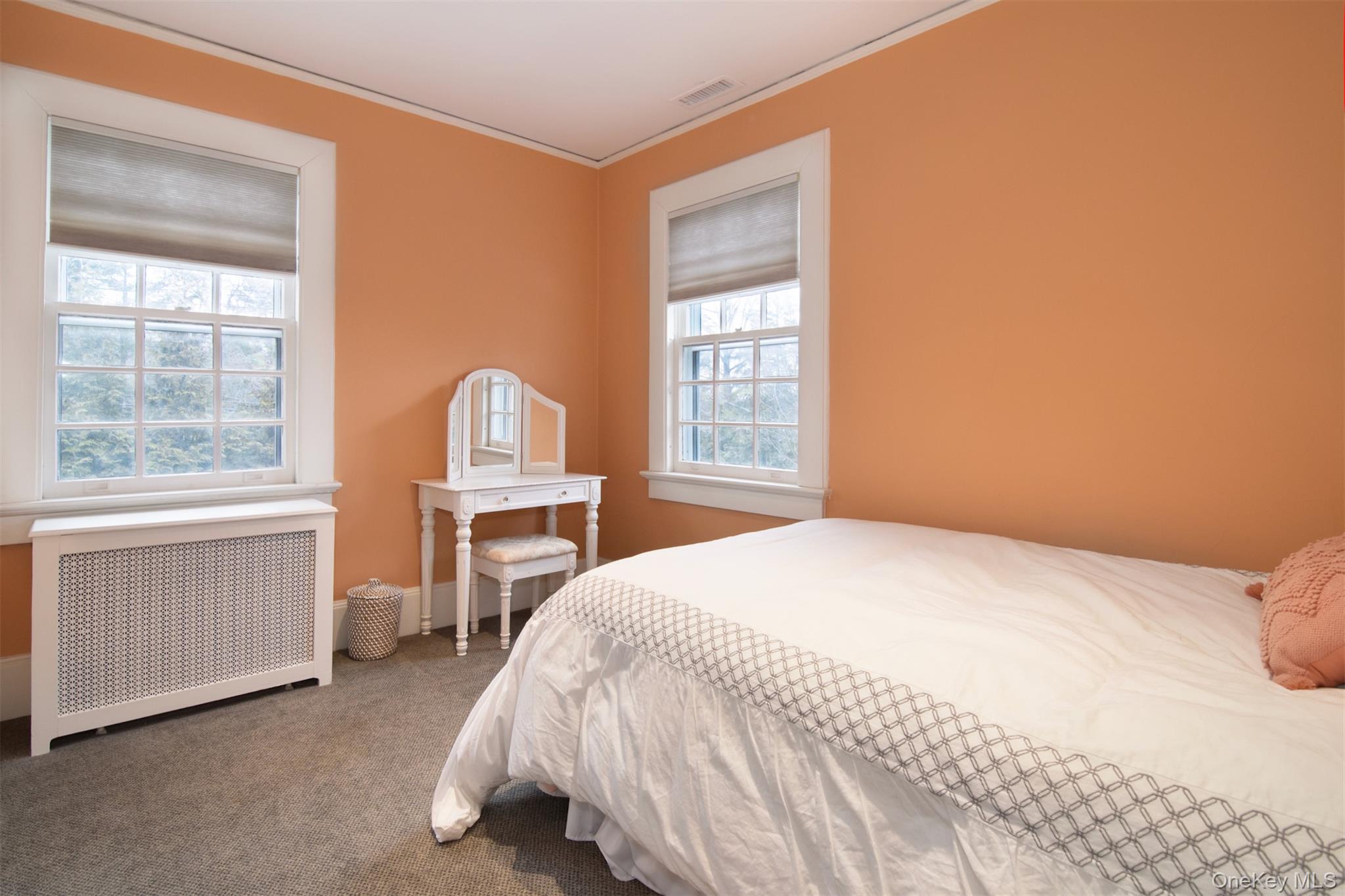 4610 Boston Post Road Pelham, NY 10803 - Photo 28 of 32 a bedroom with a bed and a window with chair