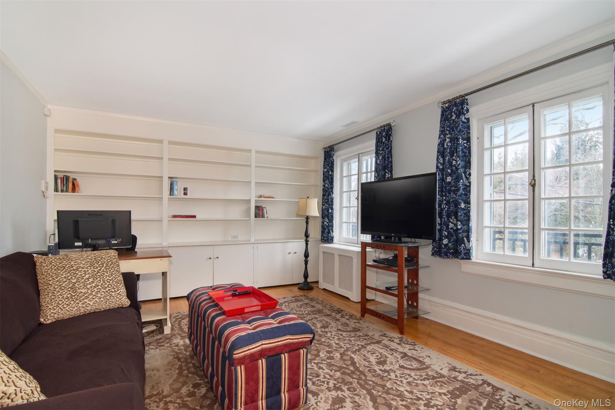 4610 Boston Post Road Pelham, NY 10803 - Photo 29 of 32 a living room with furniture and a flat screen tv