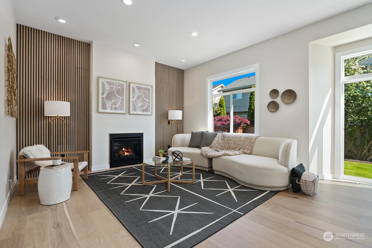 1332 237th Place Southwest Bothell, WA 98021 - Photo 13 of 29 a living room with furniture wooden floor and a fireplace