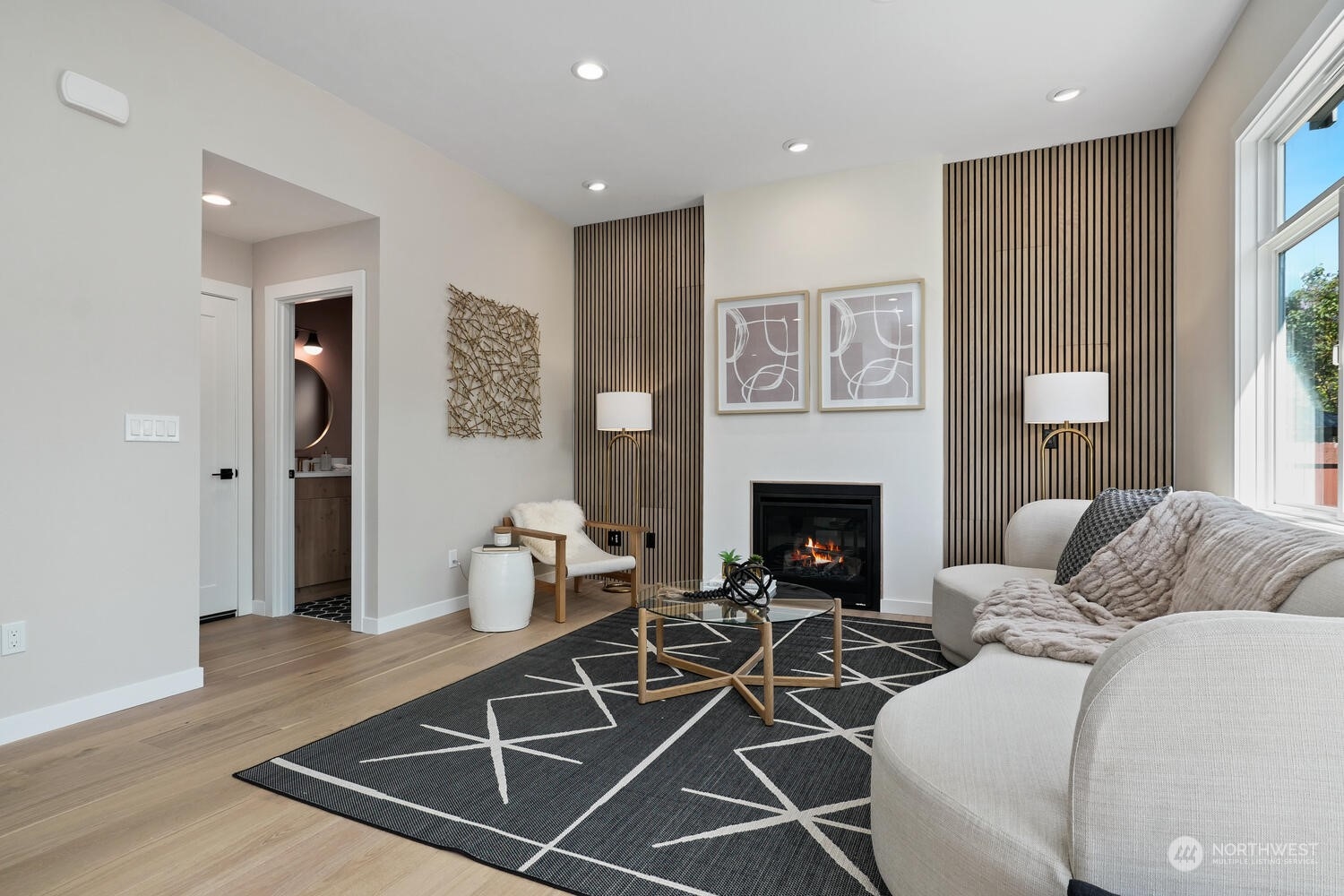 1332 237th Place Southwest Bothell, WA 98021 - Photo 14 of 29 a living room with furniture a window and a fireplace
