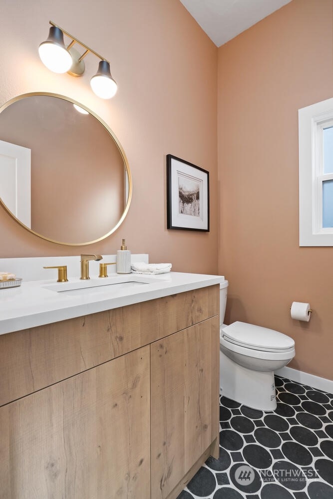 1332 237th Place Southwest Bothell, WA 98021 - Photo 16 of 29 a bathroom with a toilet a sink and mirror