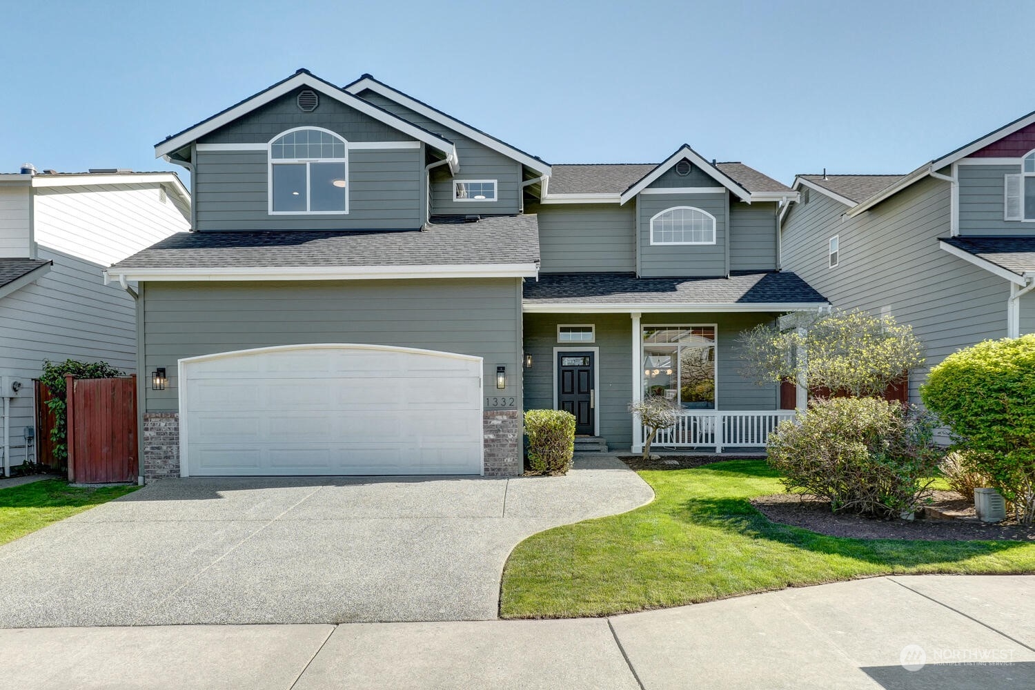 1332 237th Place Southwest Bothell, WA 98021 - Photo 2 of 29 a front view of a house with garden
